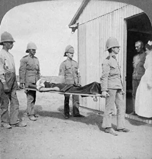 Stretcher Case Collection: Wounded fusilier after the Boers brave stand near Orange River, South Africa, Boer War, 1900