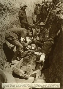 Treating Prints: Wounded soldier being treated in the trenches