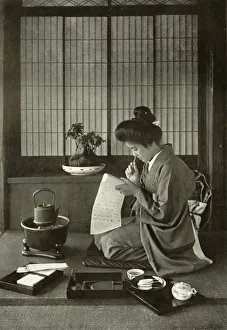 Tea Service Prints: Writing A Letter, 1910. Creator: Herbert Ponting