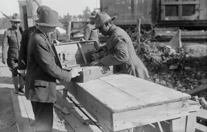 Suitcase Prints: Yaphank, examining packages, 11 Sept 1917. Creator: Bain News Service