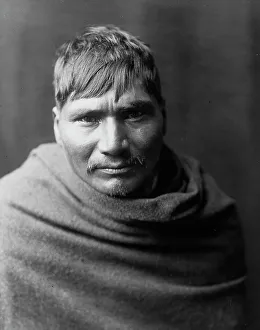 Yaqui man, head-and-shoulders portrait, facing front, c1907. Creator: Edward Sheriff Curtis