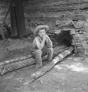 Tobacco Collection: Ten year old son of tobacco sharecropper... tobacco... Granville County, North Carolina, 1939