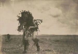 Ceremonial Collection: Yeibichai, the beggar, Tonenili-Navajo Indian, dressed in spruce branches, 1904, c1905
