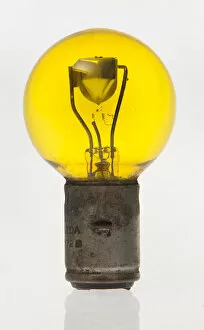 Automibilia Gallery: Yellow headlamp bulb. Creator: Unknown