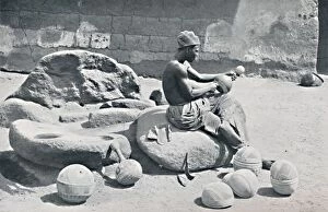 Water Jar Collection: A Yoruba man engraving clay bowls and water jars, Lagos hinterland, Southern Nigeria, 1912