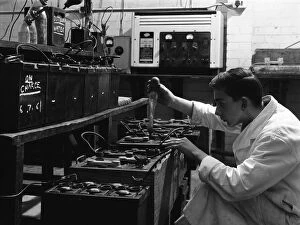 Motor Maintenance Gallery: A young apprentice at Globe & Simpson auto electricians workshop, Lincoln, Lincolnshire, 1961
