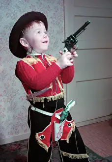 Controversy Prints: Young boy in a cowboy outfit, c1955. Creator: Arthur Charles Kirby Ware