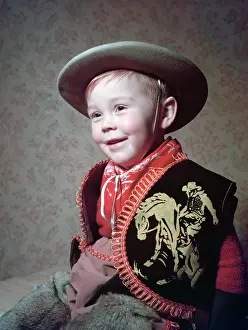 Gender Prints: Young boy in a cowboy outfit, c1955. Creator: Arthur Charles Kirby Ware