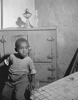 Housing Conditions Collection: A young boy who lives near the nations capitol, Washington, D. C. 1942. Creator: Gordon Parks