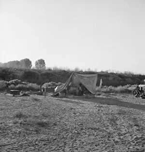 Shelter Collection: Young family on ditch bank, waiting to enter... camp (FSA), Merrill, Klamath County, Oregon, 1939