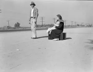 Suitcase Prints: Young family, penniless, hitchhiking on U