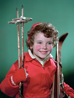 Rosy Cheeked Prints: Young girl with cross-country ski equipment, c1955. Creator: Arthur Charles Kirby Ware