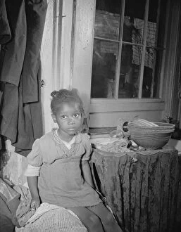 Living Conditions Gallery: Young girl who lives near the Capitol, Washington, D.C. 1942. Creator: Gordon Parks