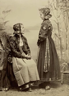 Teenagers Collection: Two young girls pose in costumes from Dala-Floda with floral jackets and hats, 1890-1900
