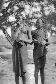 African Gallery: Young girls with sticks in their noses and lips, Terrakekka to Aweil, Sudan, 1925 (1927)