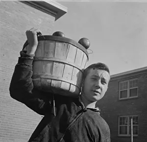 Market Porter Prints: Young huckster in the Southwest section, Washington, D. C. 1942. Creator: Gordon Parks