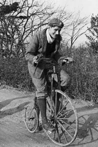 Cyclist Prints: A young Lord Nuffield riding a bicycle down a country lane