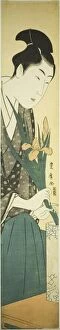 Young man arranging irises in a vase, n.d. Creator: Utagawa Toyohiro