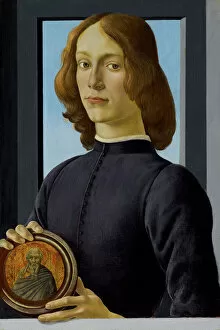 Tempera And Oil On Wood Collection: Young Man Holding a Roundel, c. 1480. Creator: Botticelli, Sandro (1445-1510)