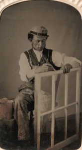 Window Frame Prints: Young Man Painting Window Frame, 1860s-80s. Creator: Unknown