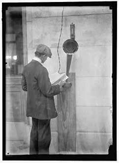 Speaker Prints: Young man standing near speaker