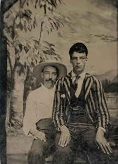 Blazer Gallery: Young Man in a Striped Jacket, Sitting on the Lap of Another Man in Front of Painted