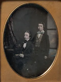 Daguerreotype Prints: Two Young Men in Bow Ties, One Seated Holding a Book, One Standing, 1850s