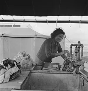 Washing Collection: Young migrant girl makes use of facilities... Merrill FSA camp, Klamath County, Oregon, 1939