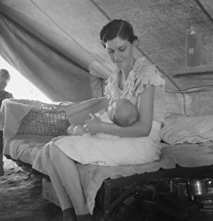 Refugee Gallery: Young migrant mother with six weeks old baby born in a hospital with aid... near Westley, CA, 1939