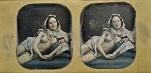 Erotic Collection: Young scantily clad woman, lying on her side. Creator: Unknown