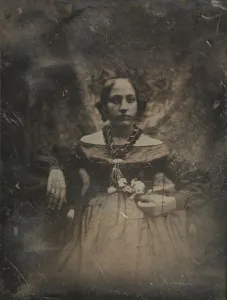 De Prangey Prints: Young woman holding a flower, ca. 1842. Creator: Joseph Philibert Girault De Prangey