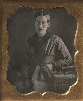 Androgynous Gallery: Young Woman Seated Next to a Table with Elbow Resting on a Book, 1840s. Creator: Unknown