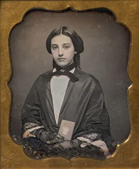 Images Dated 10th August 2020: Young Woman Wearing Lace Gloves Holding a Daguerreotype Case, 1860s. Creator: Unknown