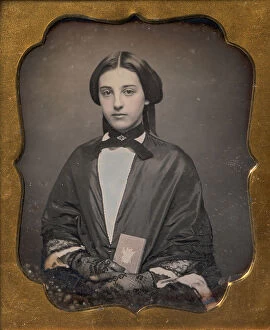 Case Gallery: Young Woman Wearing Lace Gloves Holding a Daguerreotype Case, 1860s. Creator: Unknown
