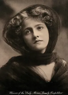 A young woman, winner of a beauty contest, wearing a large black hat with a trailing scarf... c1904 Creator: Unknown