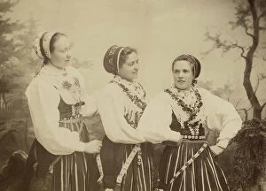 Position Collection: Three young women dressed in costumes from Leksand, Dalarna, 1886-1920. Creator: Helene Edlund