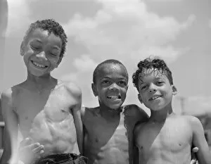 Three youngsters, Frederick Douglass housing project, Anacostia, D.C. 1942. Creator: Gordon Parks