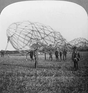 Framework Collection: Zeppelin shot down near Colchester, Essex, World War I, 1916. Artist: Realistic Travels Publishers